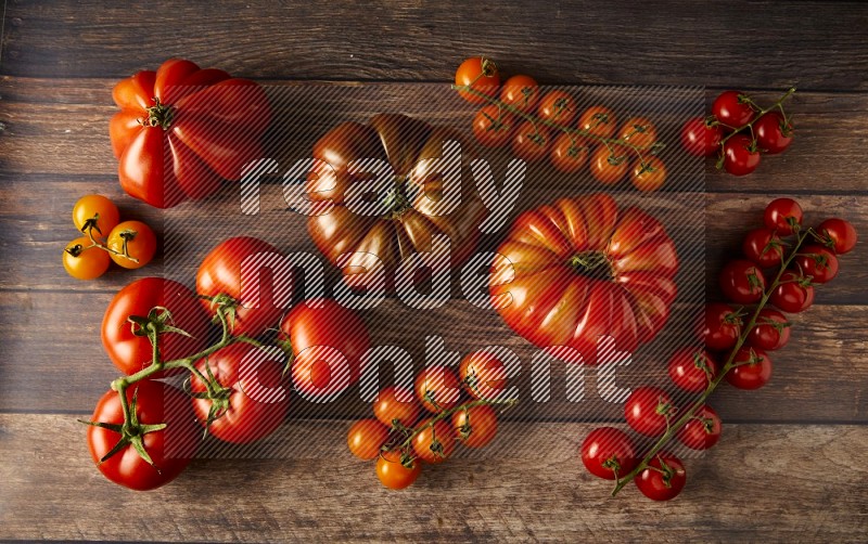 Mixed Tomatoes types topview on a textured vinyl backgrounds