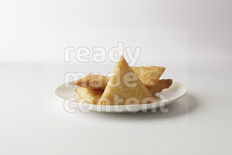 sambosas on a white background