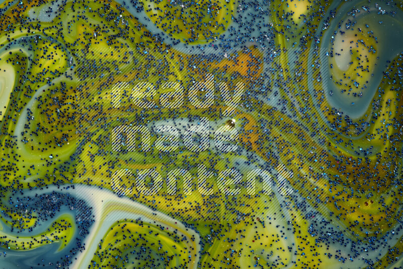 لقطة مقربة لبريق أزرق متلألئ منتشر على خلفية من اللون الأزرق والأصفر في حركات دائرية