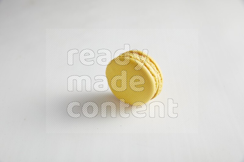 45º Shot of Yellow Lemon macaron on white background