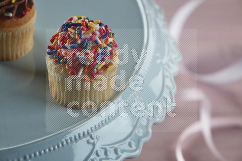 Vanilla mini cupcake topped with sprinkles