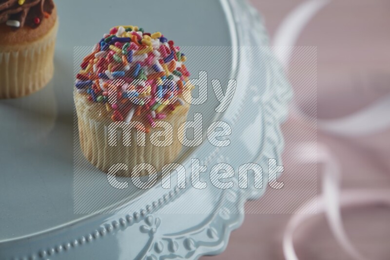 Vanilla mini cupcake topped with sprinkles