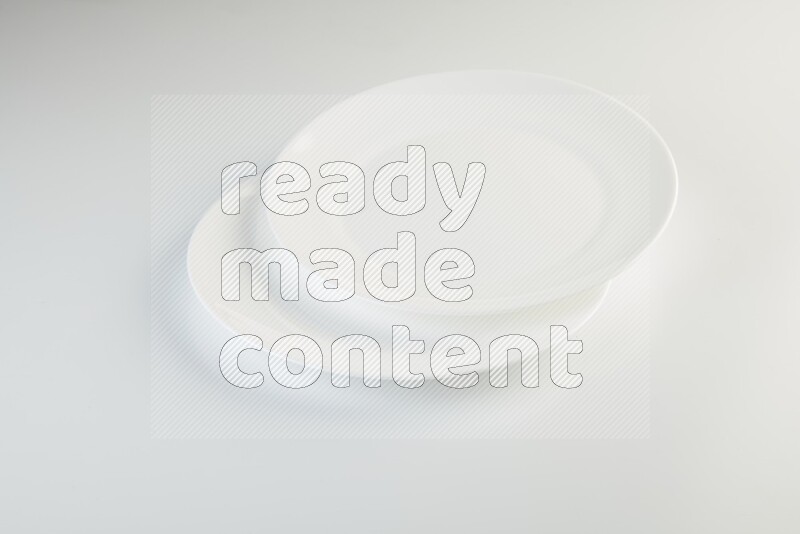 white and black plates on white background