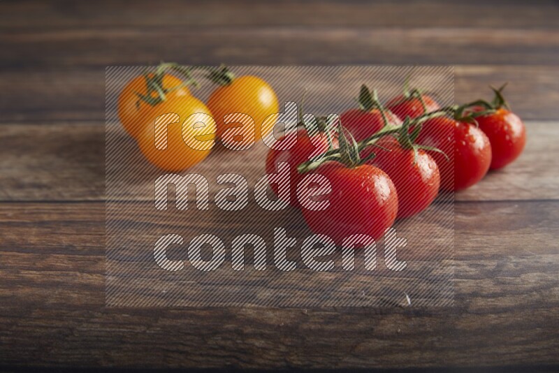 Mixed cherry tomato veins on a textured wooden background 45 degree