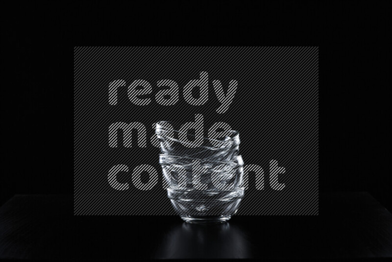 Glassware with rim light against black background