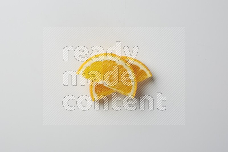 Two halves of an orange slices on white background