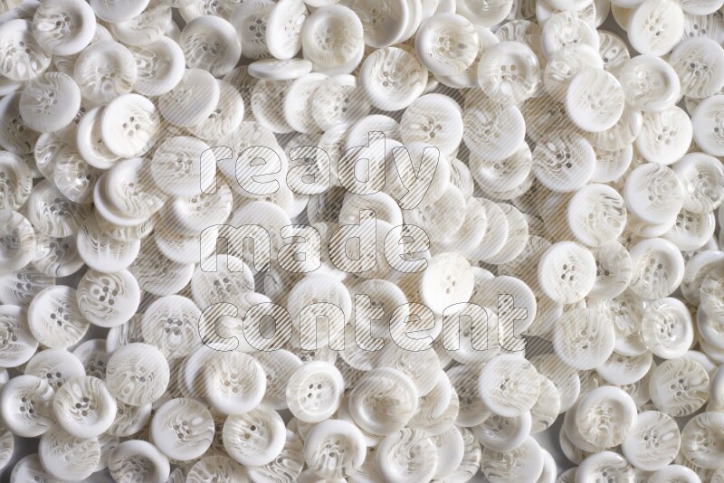 White buttons placed on grey background