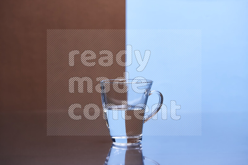 The image features a clear glassware filled with water, set against brown and light blue background