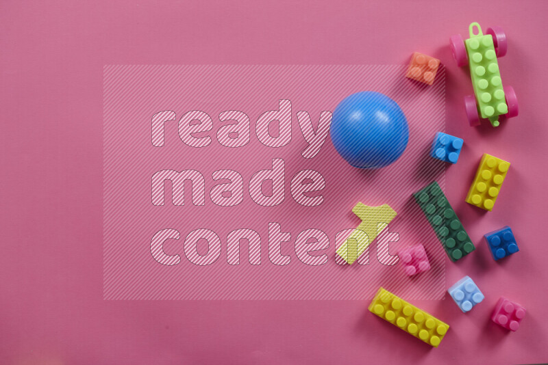 Plastic building blocks with balls on different colored background (kids toys)