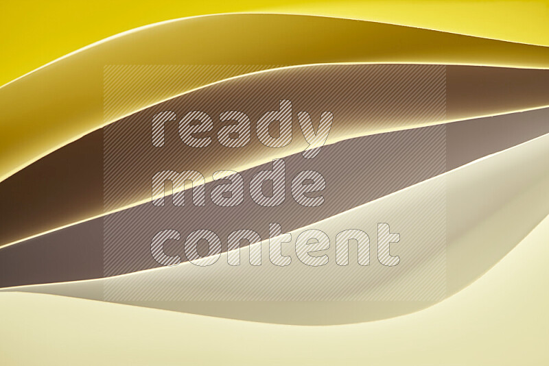 This image showcases an abstract paper art composition with paper curves in gold gradients created by colored light