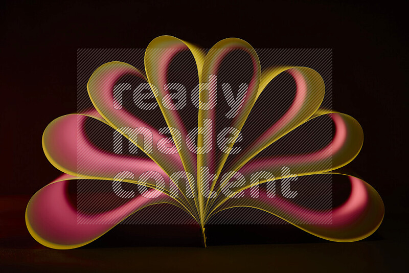 An abstract art piece displaying smooth curves in yellow and red gradients created by colored light