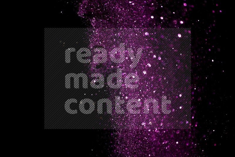 Pink glitter powder isolated on black background