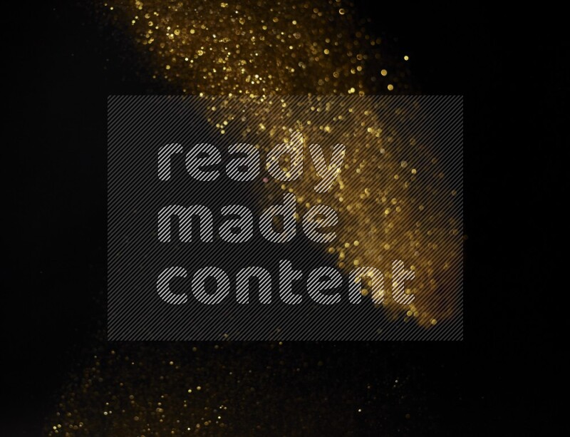 Gold glitter powder isolated on black background