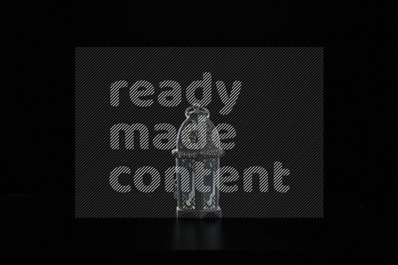 Ramadan lantern with rim light against black background