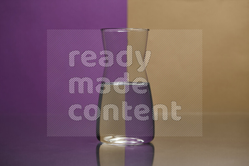 The image features a clear glassware filled with water, set against purple and beige background