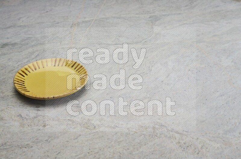 Multicolored Pottery Plate On Grey Marble Flooring