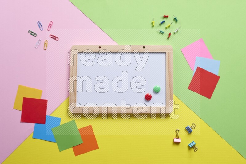 Different school supplies on multicolored background