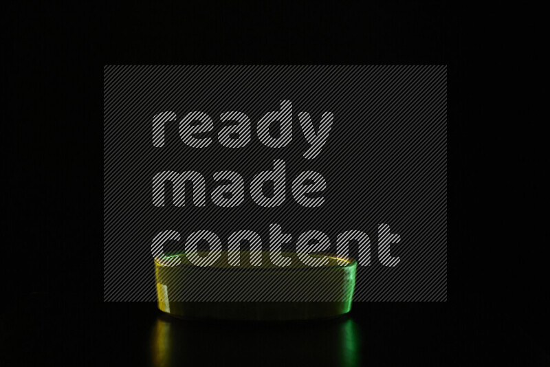 Potteries with colored rim light against black background