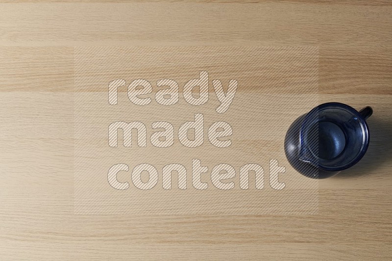 Top View Shot Of An Empty Glass Jug on Oak Wooden Flooring