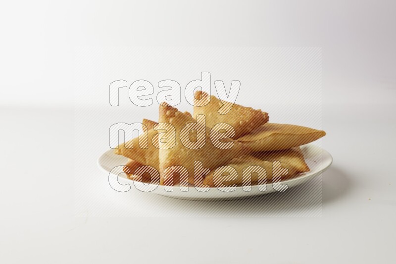 sambosas on a white background