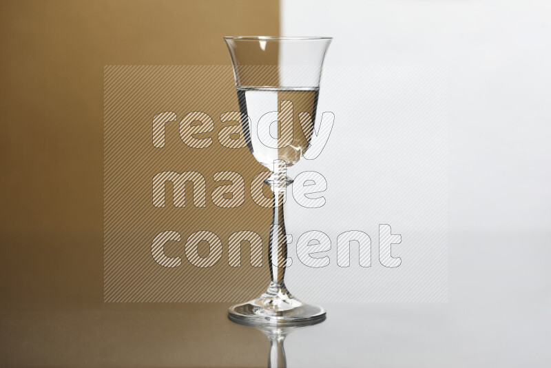 The image features a clear glassware filled with water, set against white and beige background