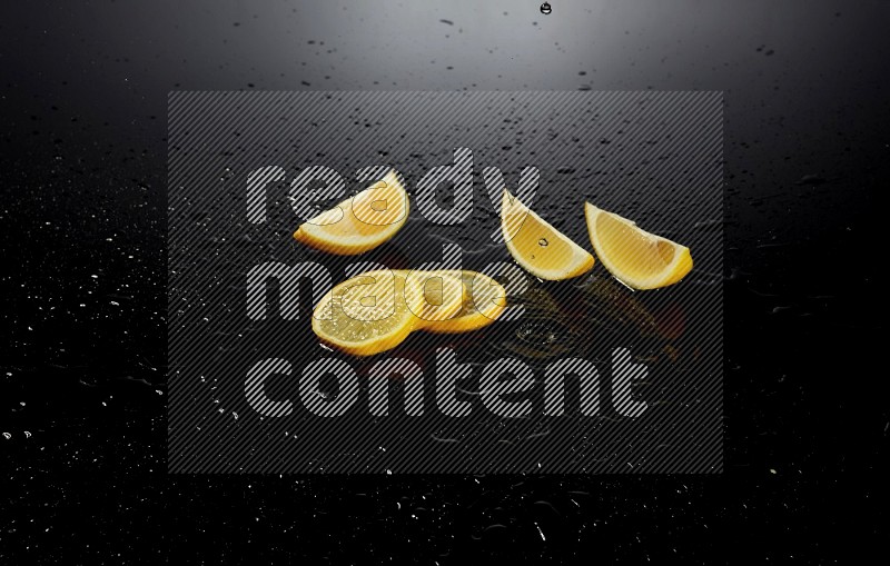 Lemon slices with water drops, and droplets on black background