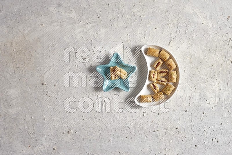 Oriental sweets in a pottery plate in a light setup