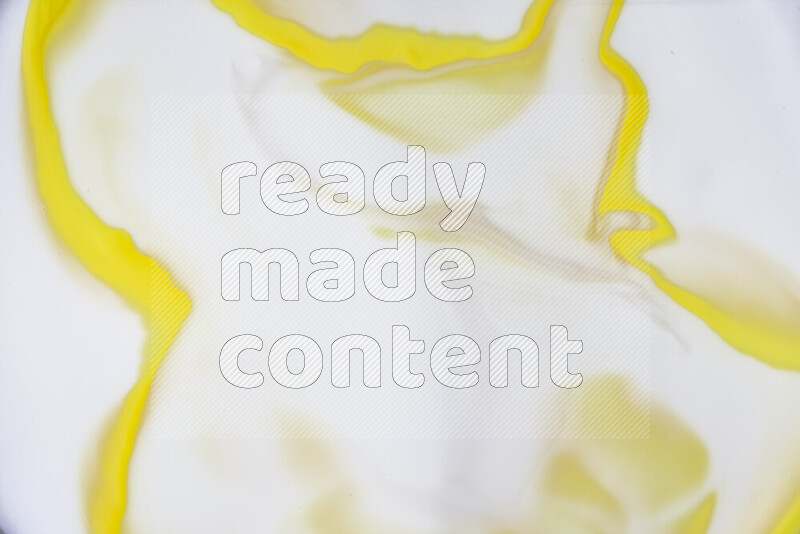 A close-up of abstract swirling patterns in yellow and white