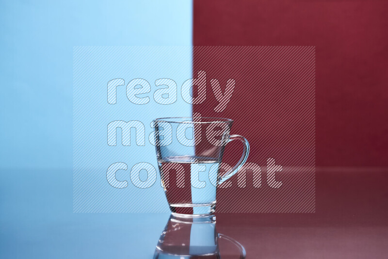 The image features a clear glassware filled with water, set against light blue and dark red background