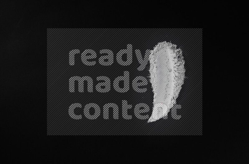 Blue powder strokes on black background