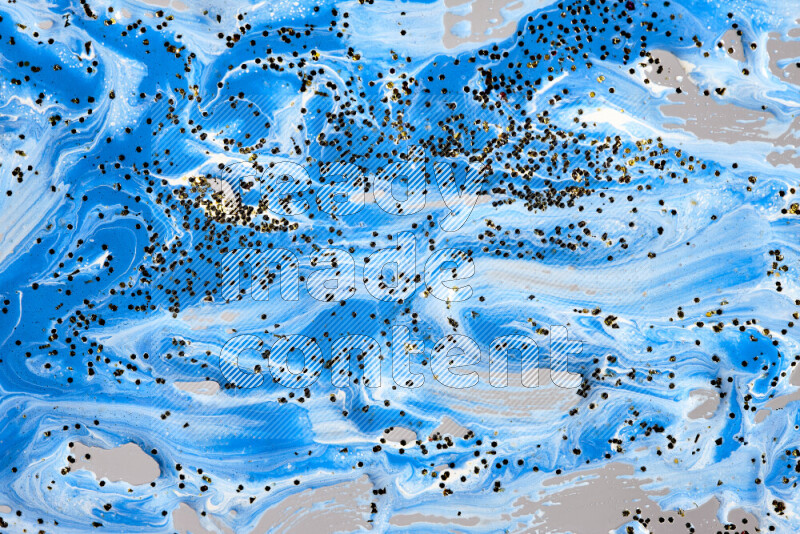 Abstract colorful background with mixed of blue and white paint colors with scattered gold glitter