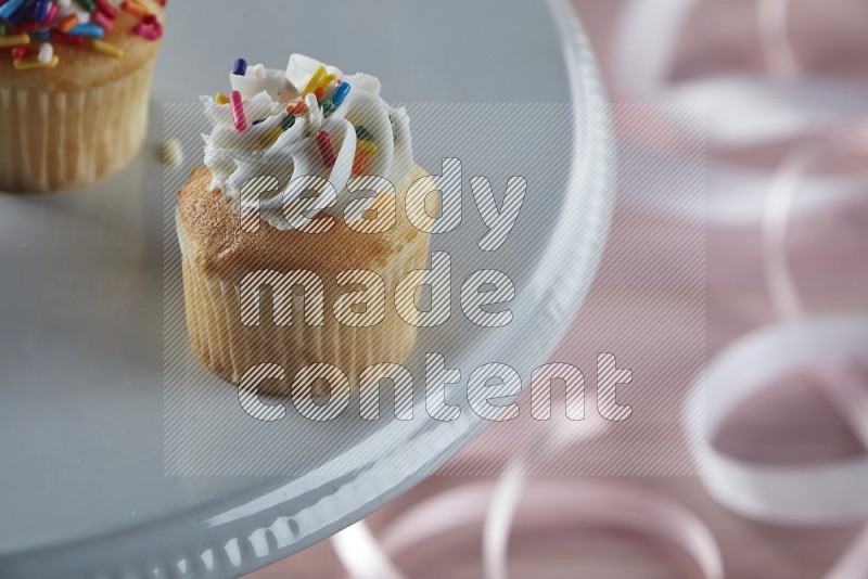 Vanilla mini cupcake topped with cream