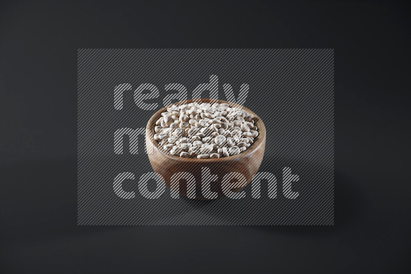 Lupin Beans in a wooden bowl on grey background