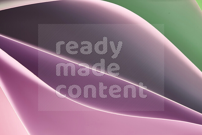 This image showcases an abstract paper art composition with paper curves in green and pink gradients created by colored light