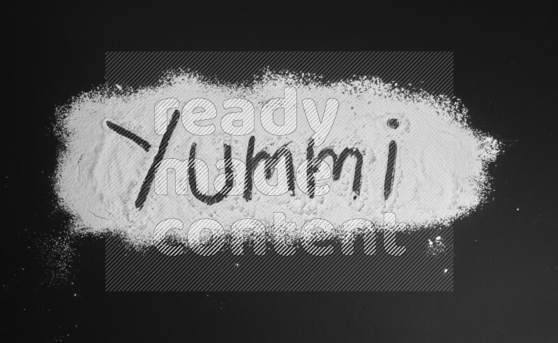 A word written with powder on black background