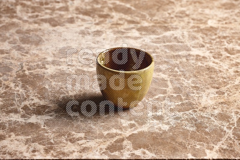 Multicolored Pottery Cup on Beige Marble Flooring, 45 degrees