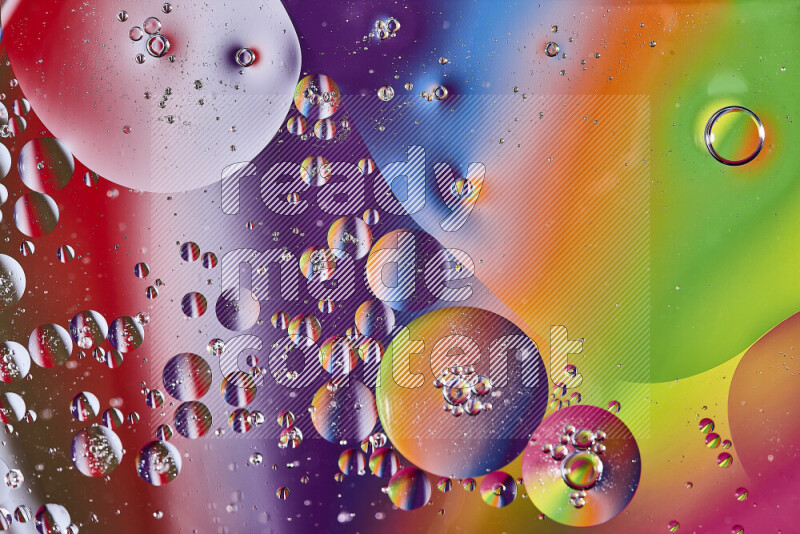 Close-ups of abstract oil bubbles on water surface in multicolors