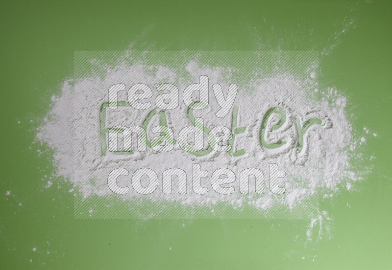 A word written with powder on green background