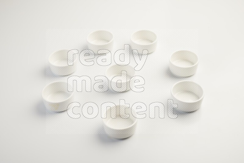white ceramic round sauce dish on white countertop