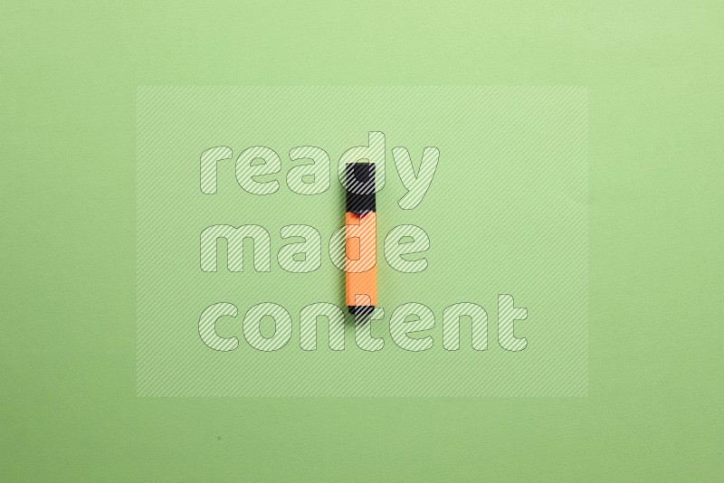 Multicolored highlighter pens on green background (back to school)
