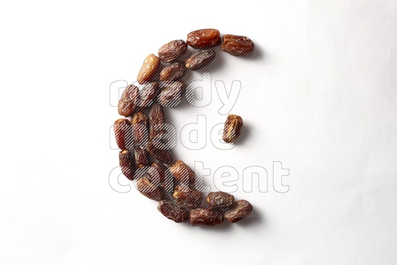 Dates in a crescent shape on white background