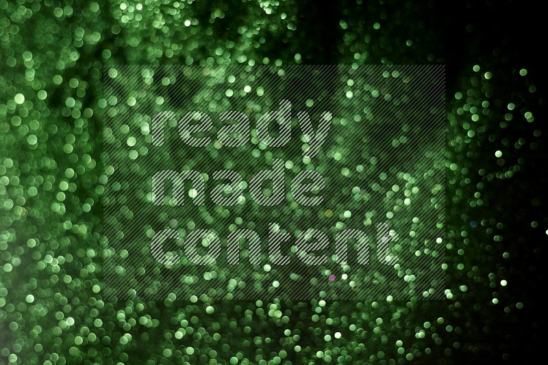 Green glitter powder isolated on black background