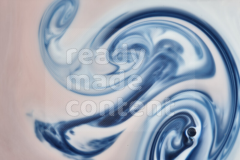 A close-up of abstract swirling patterns in blue, red and white