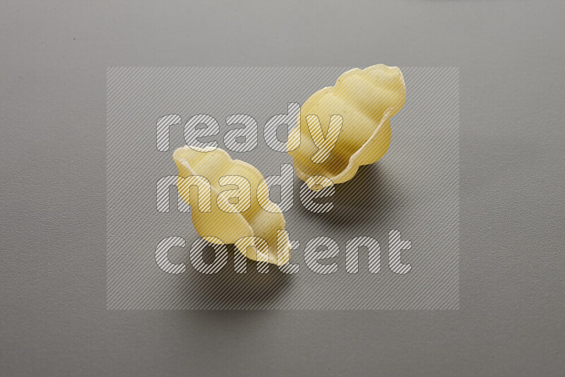 Snails pasta on grey background