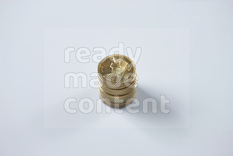 Stack Egyptian 50 piasters coins on grey background