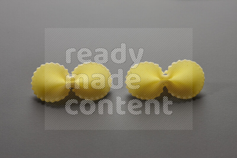 Fiocchi pasta on grey background