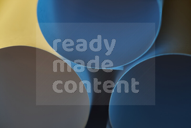 The image shows an abstract paper art with circular shapes in varying shades of blue and warm tones