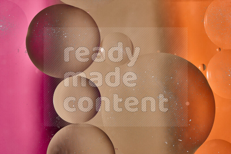 Close-ups of abstract oil bubbles on water surface in shades of brown, orange and pink