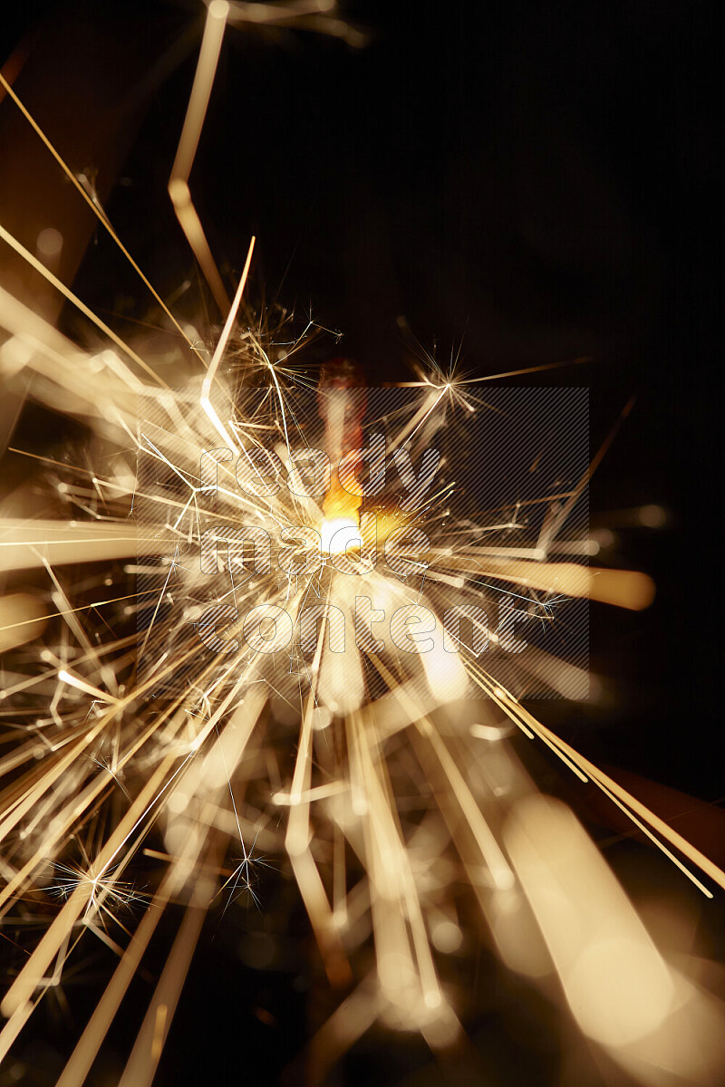 A close-up image of sparkler candle isolated on black background