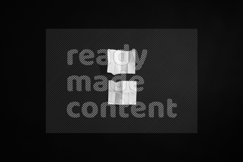 Ripped notebook sheet on black background